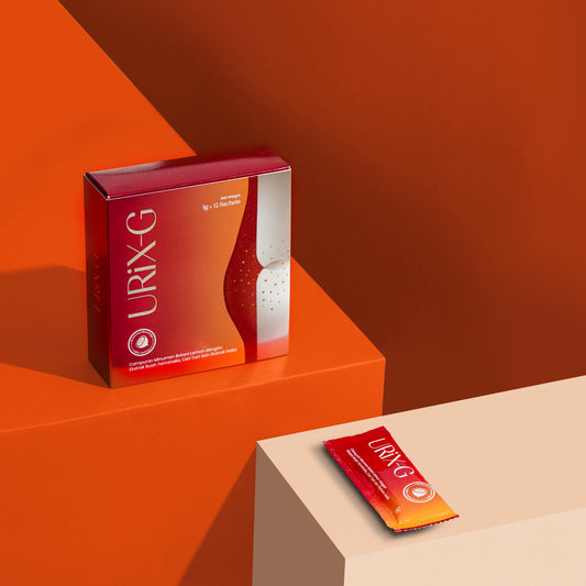 Uric acid supplement sachet and product box displayed on an orange background, featuring a botanical drink formula designed to support healthy uric acid levels, joint comfort, and daily wellness.